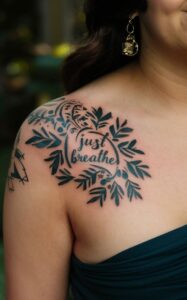just breathe tattoo with flower