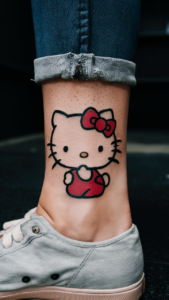 Hello kitty tattoos small - hello kitty tattoos for females - Hello kitty tattoos simple - Hello kitty tattoos ideas - hello kitty tattoo black and white